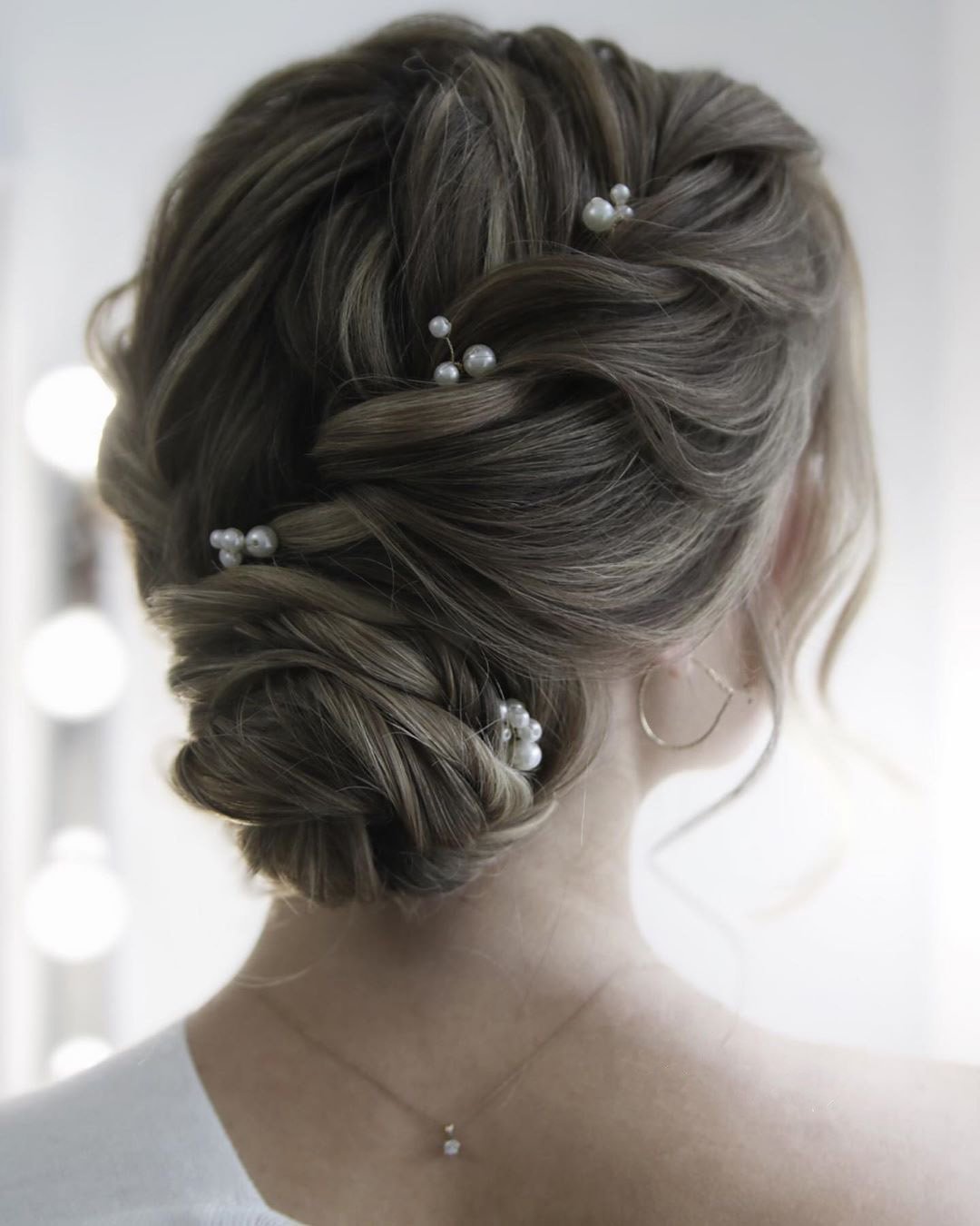 wedding updos for medium hair textured low bun with pearls juliafratichelli.bridalstylist