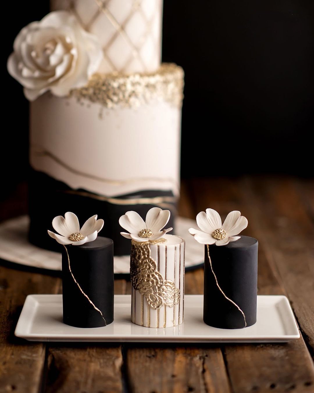 black and white wedding cakes chic gold with cupcake and flowers delacremestudio