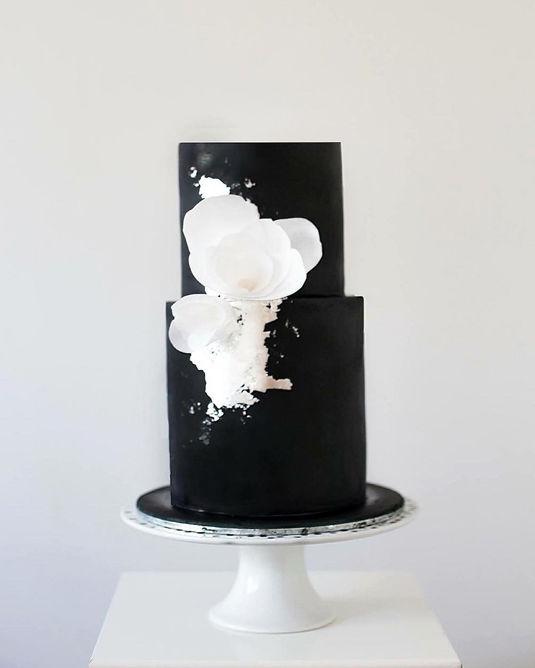 black and white wedding cakes tall silver foil and flowers sweetbakes_