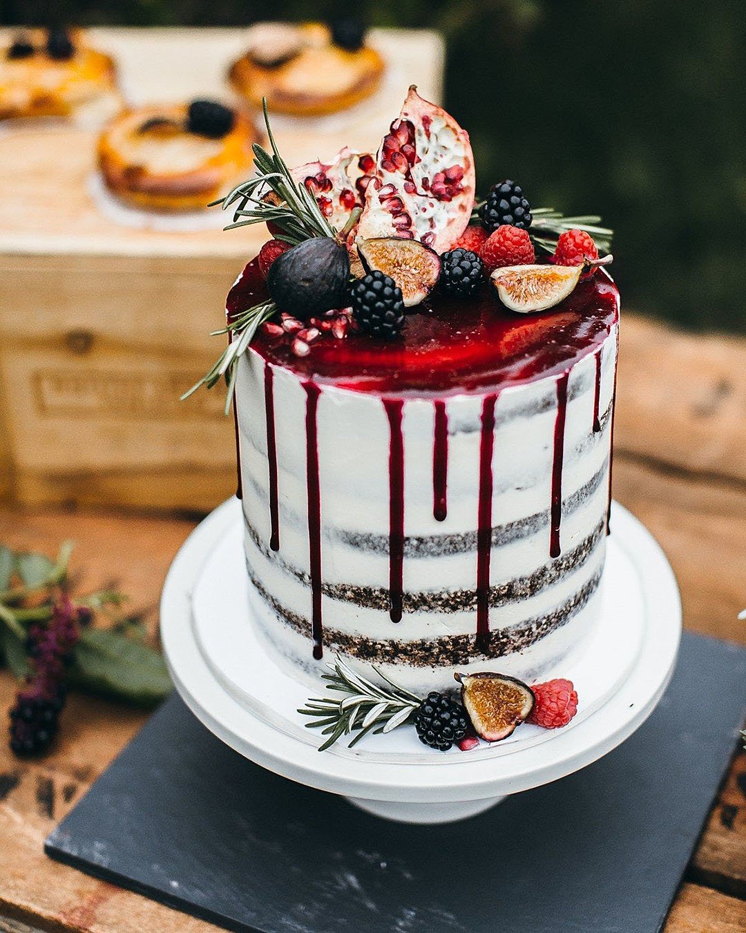 drip wedding cakes naked with fruit and red drops