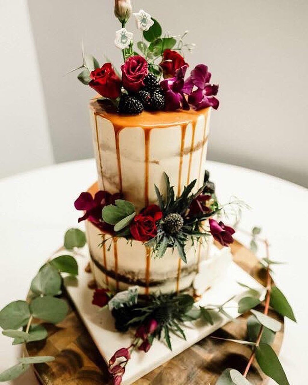 drip wedding cakes rustic drip cake burgundy flowers