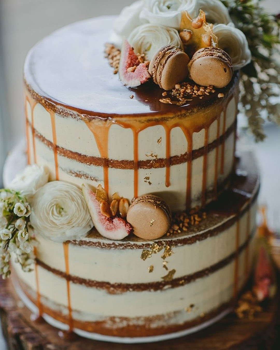 drip wedding cakes small naked with caramel drip flowers macaroons