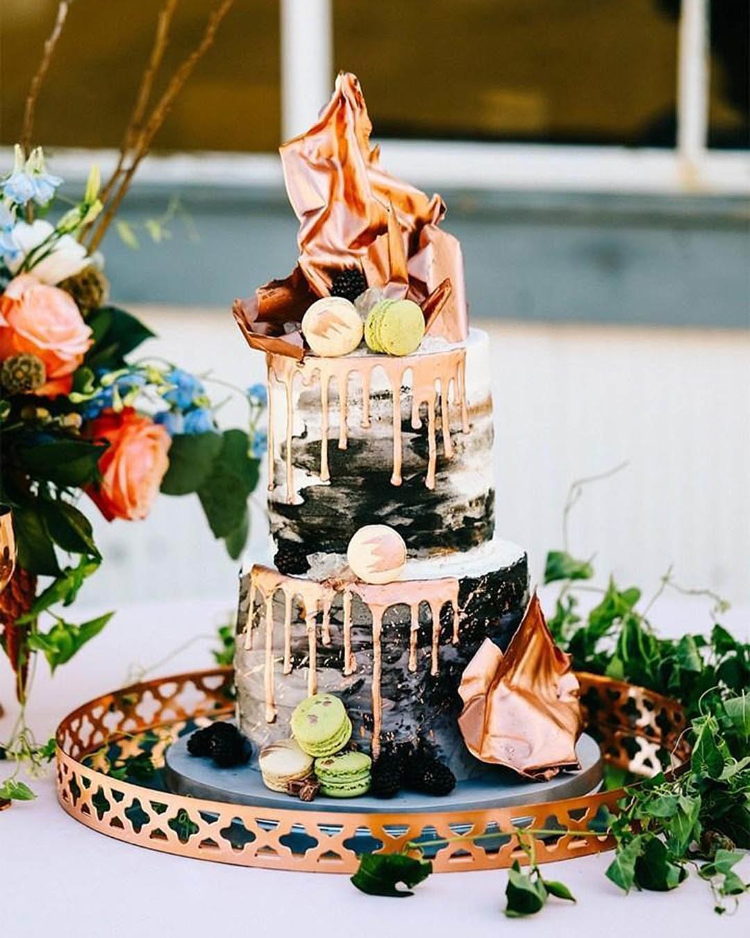 drip wedding cakes with golden details black