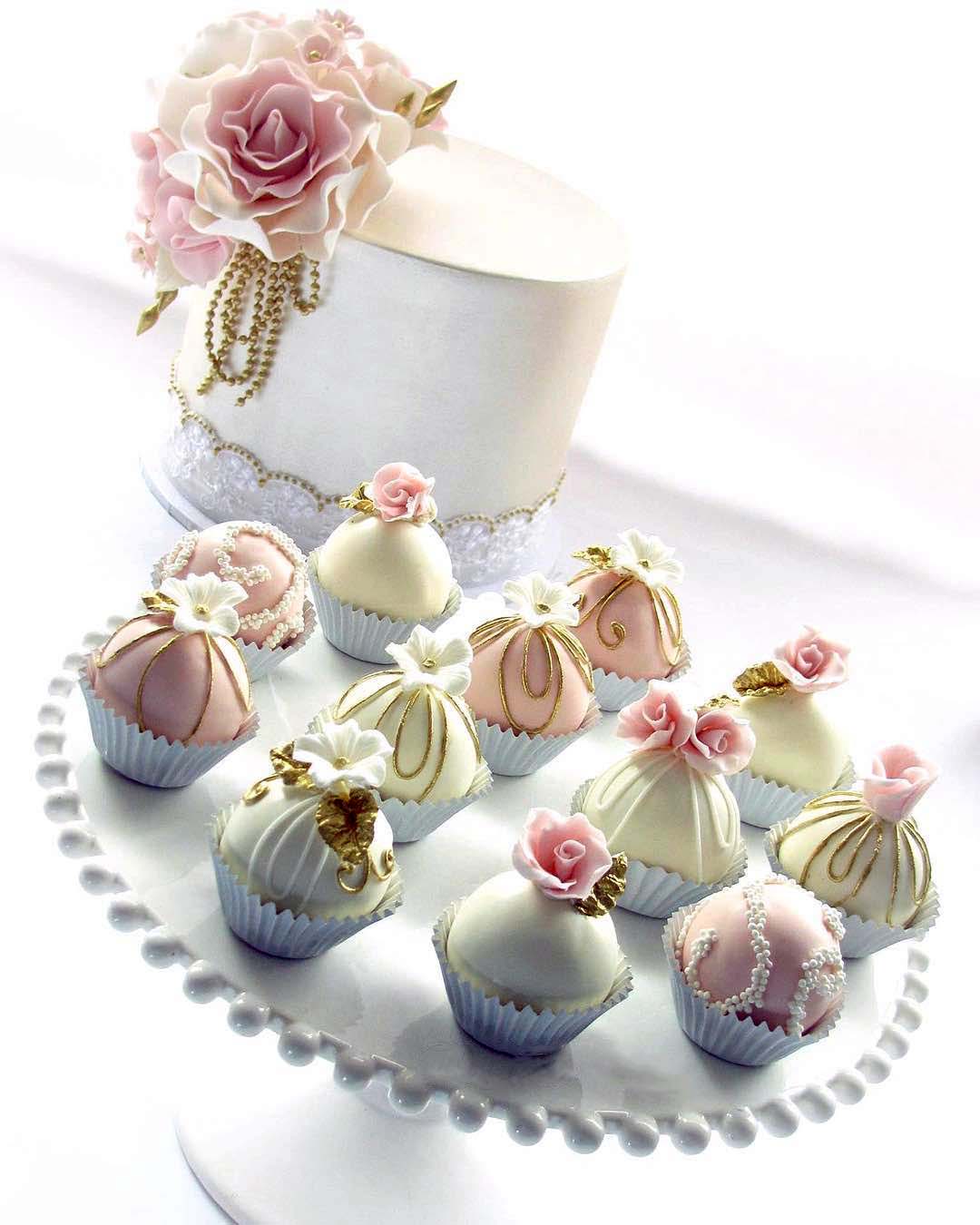 engagement party cakes small with pink flowers and poppers iconic.cake
