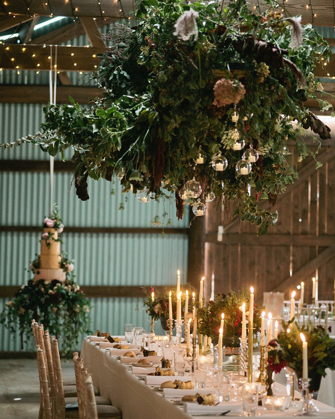 greenery wedding decor barn reception with hanging cake stand jenismithphotography