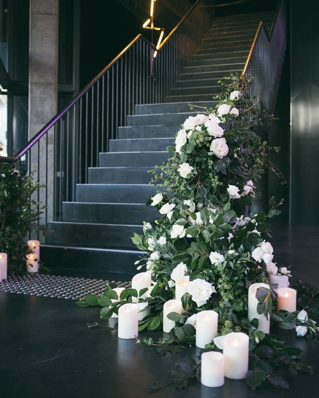 greenery wedding decor white flowers candles on the stairs hikari photo