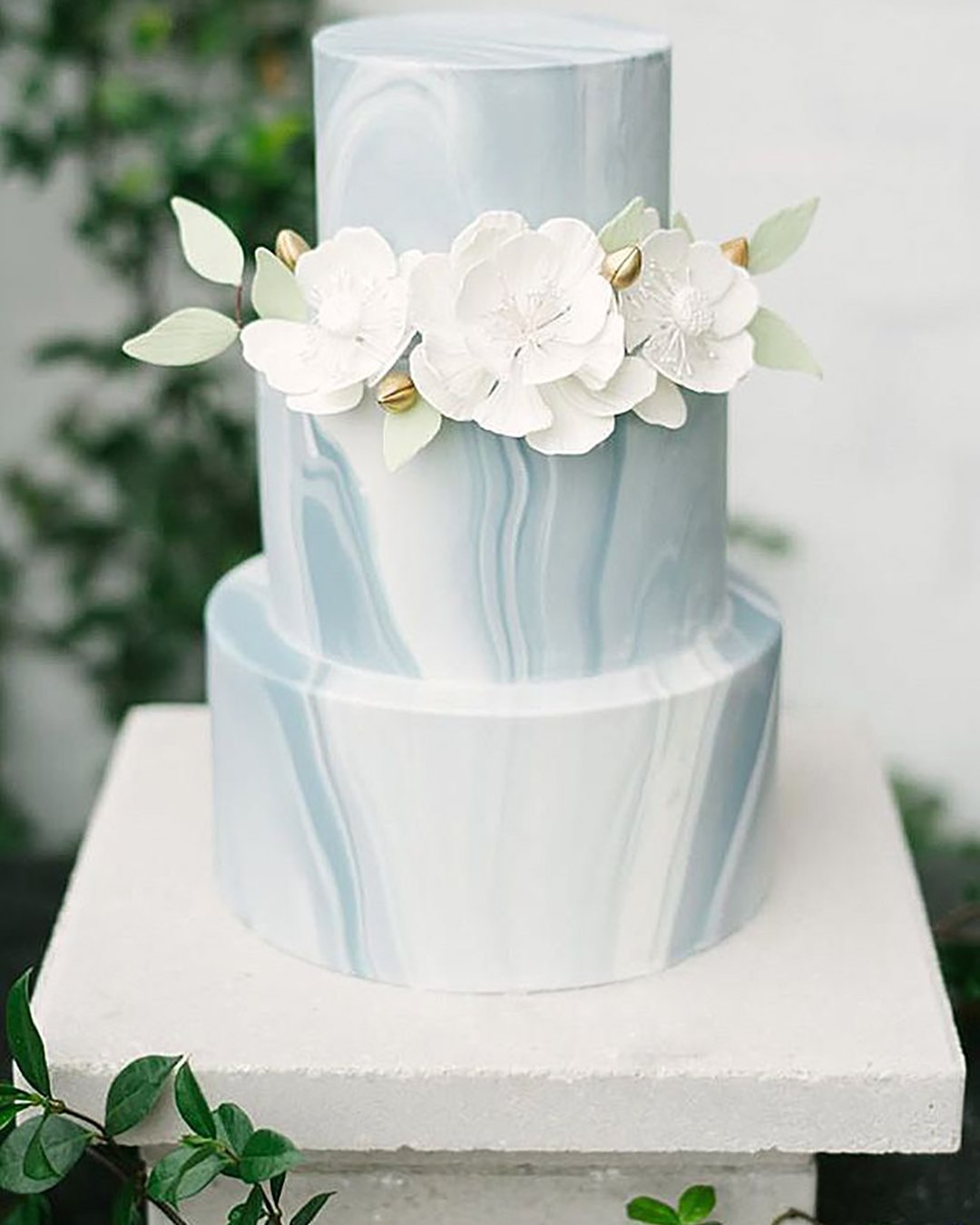marble wedding cakes three tier with white flowers golden buds and leaves marry me tampa bay via instagram