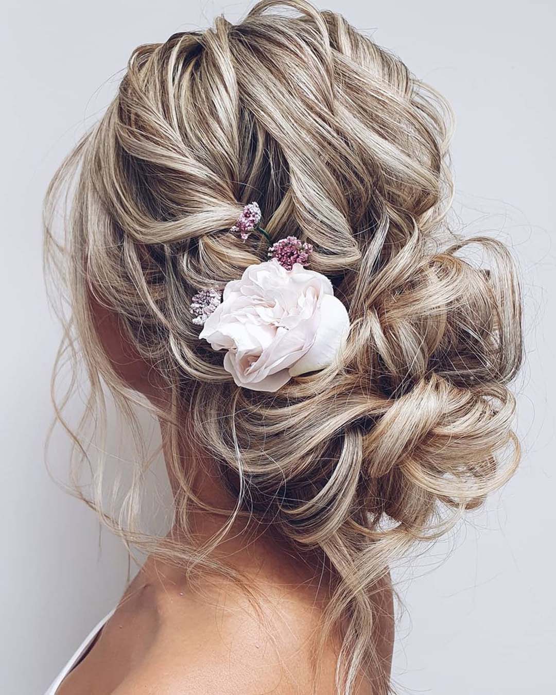 wedding hairstyles for thin hair volume slightly messy bun with flowers hairbyhannahtaylor