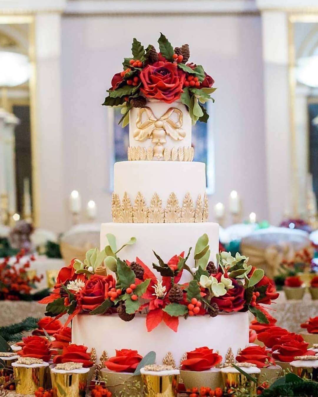 winter wedding cakes huge tall white gold with red flowers and greenery elizabethscakeemporium