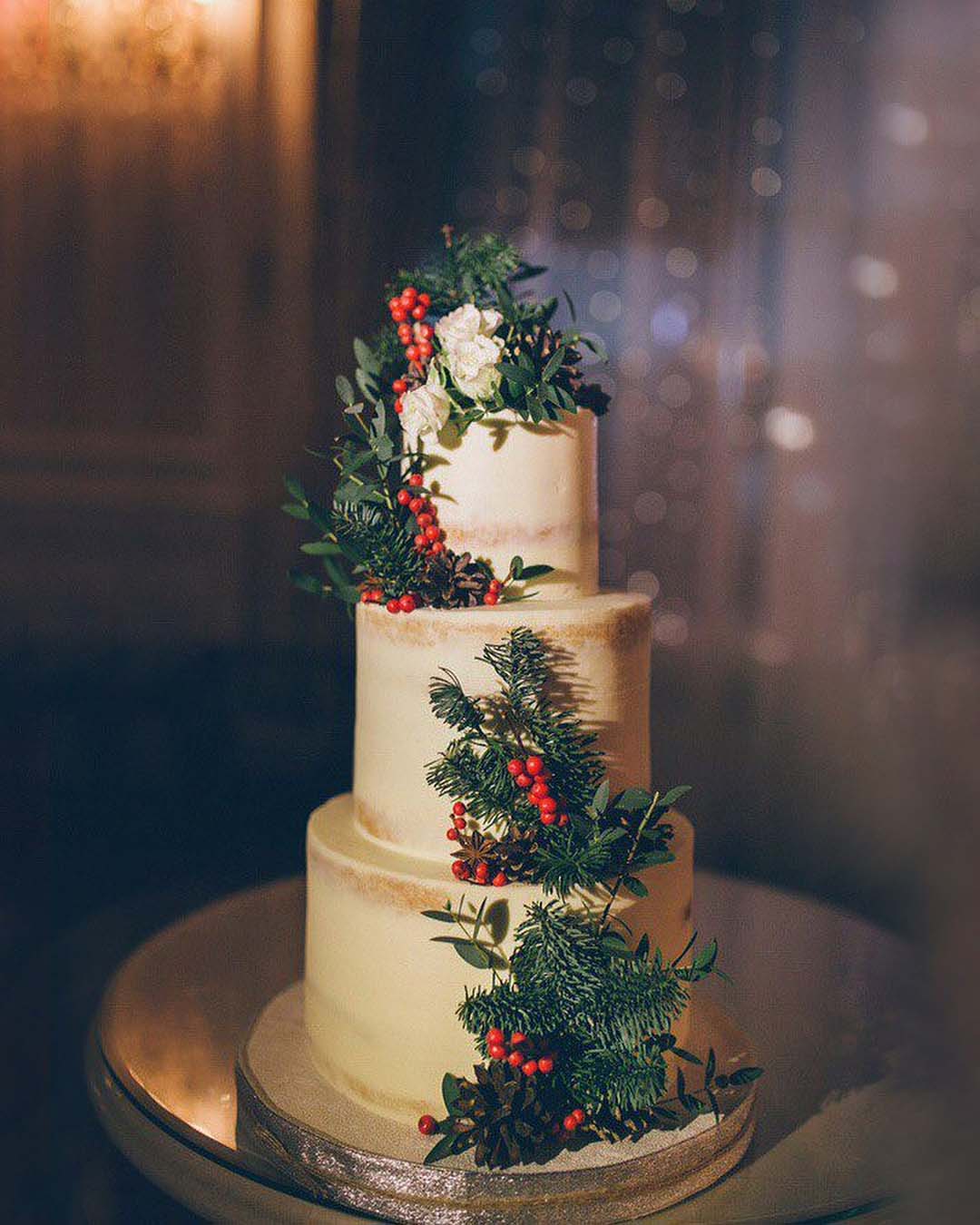 winter wedding cakes tall white with spruce branches and cones nadezda_axenova