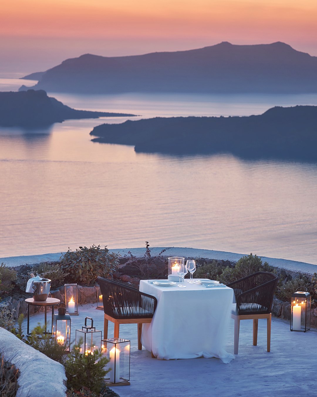 best honeymoon resorts a beautiful sunset for couple santorini vedema resort