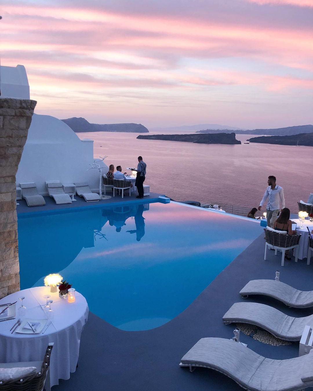 best honeymoon resorts a restaurant near the pool santorini greece