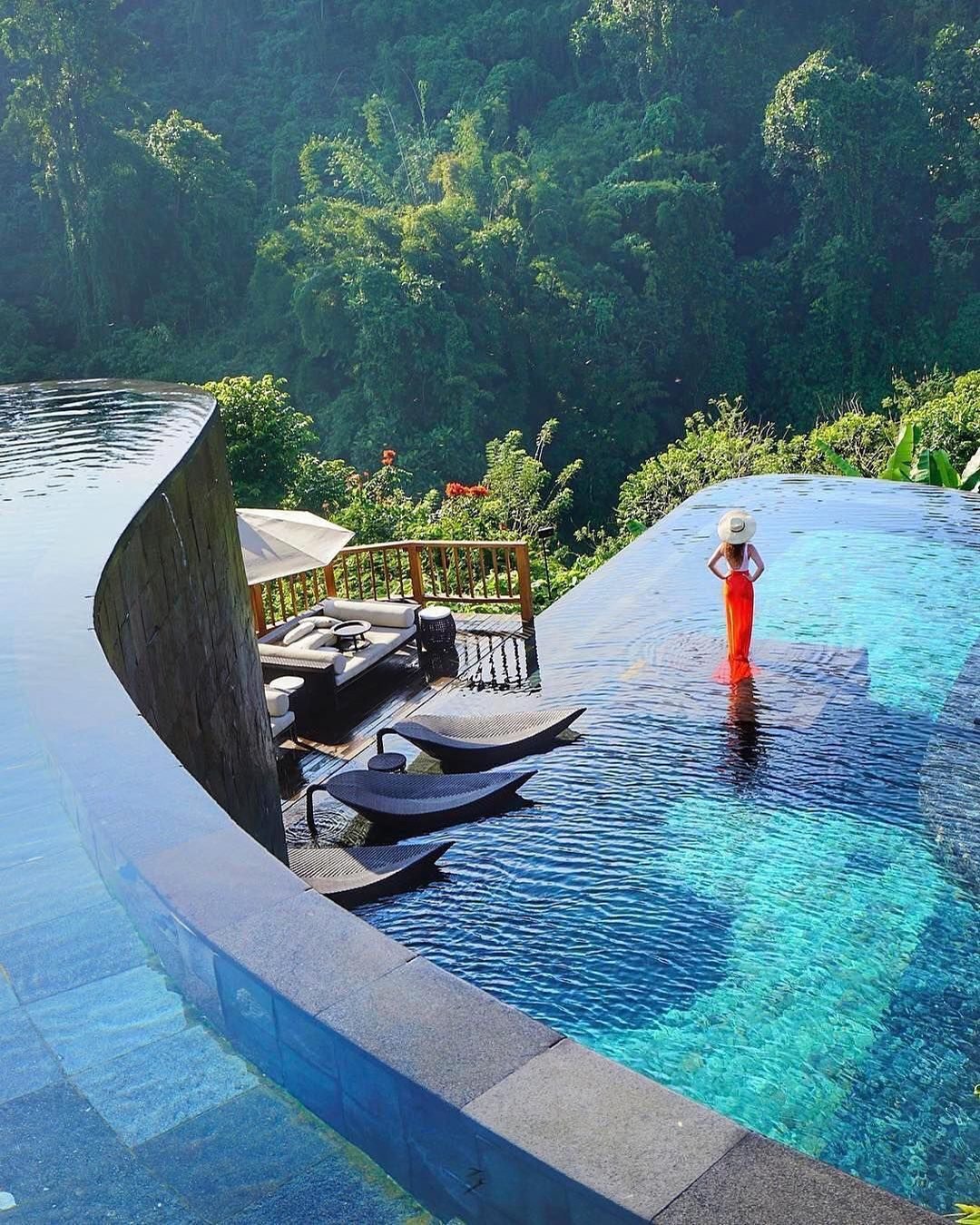 best honeymoon resorts cascading pools and girl hanging garden ubud hotel bali wanderlust