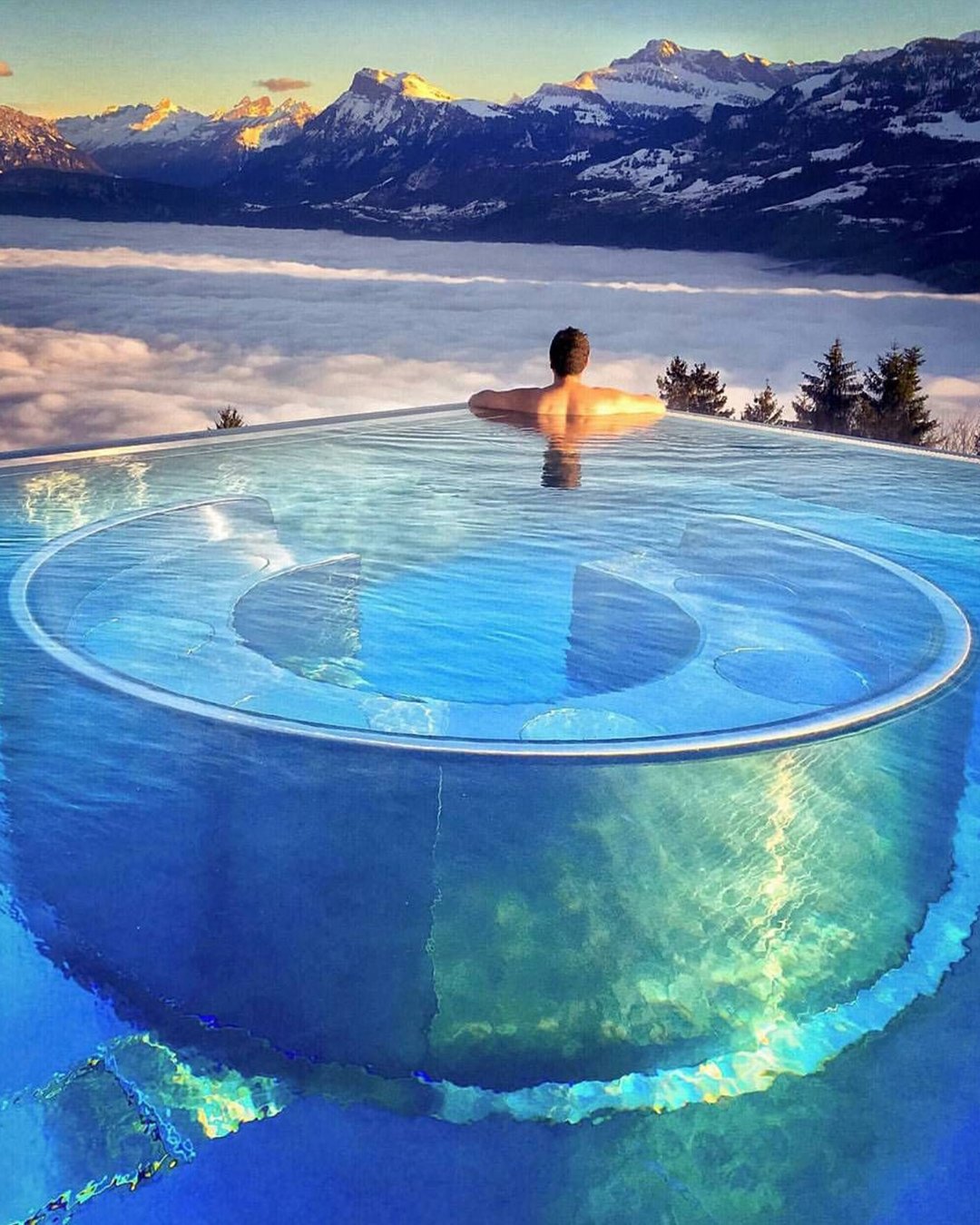 best honeymoon resorts villa honegg ennetbürgen mountain view man in pool villahonegg