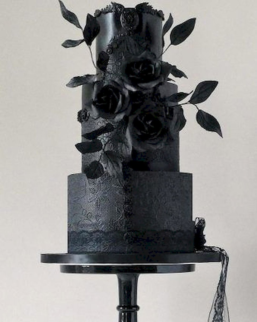 black wedding cake ckae with black flower havesomecakeuk