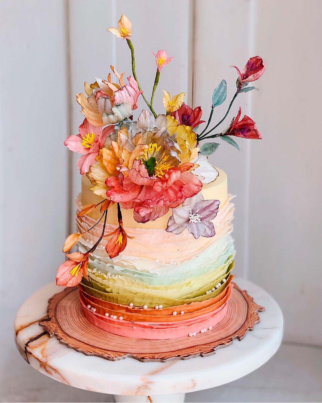 same sex wedding ideas rainbow cake flowers