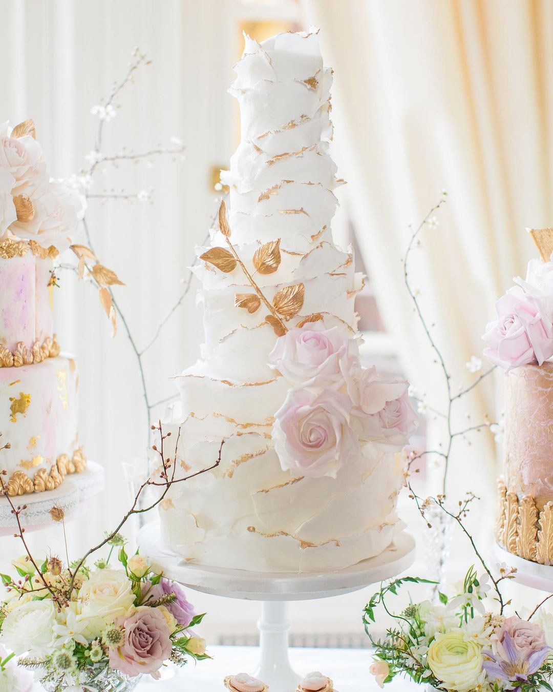 wedding cake designers gentle white ruffles with roses elizabethscakeemporium