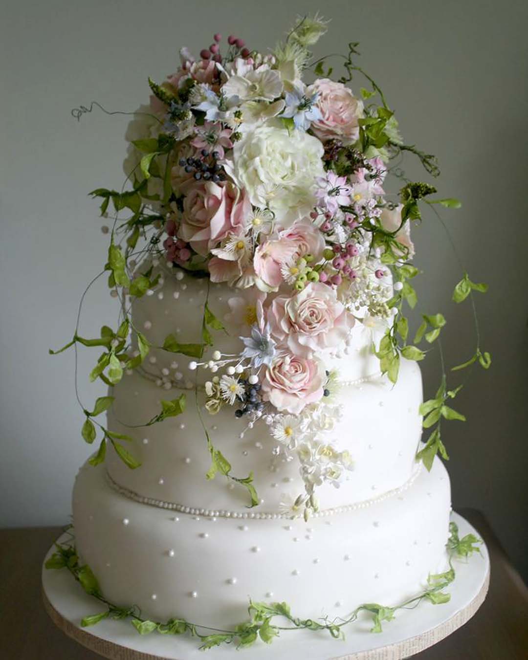 wedding cake designers white with flowers and greens swann.amy