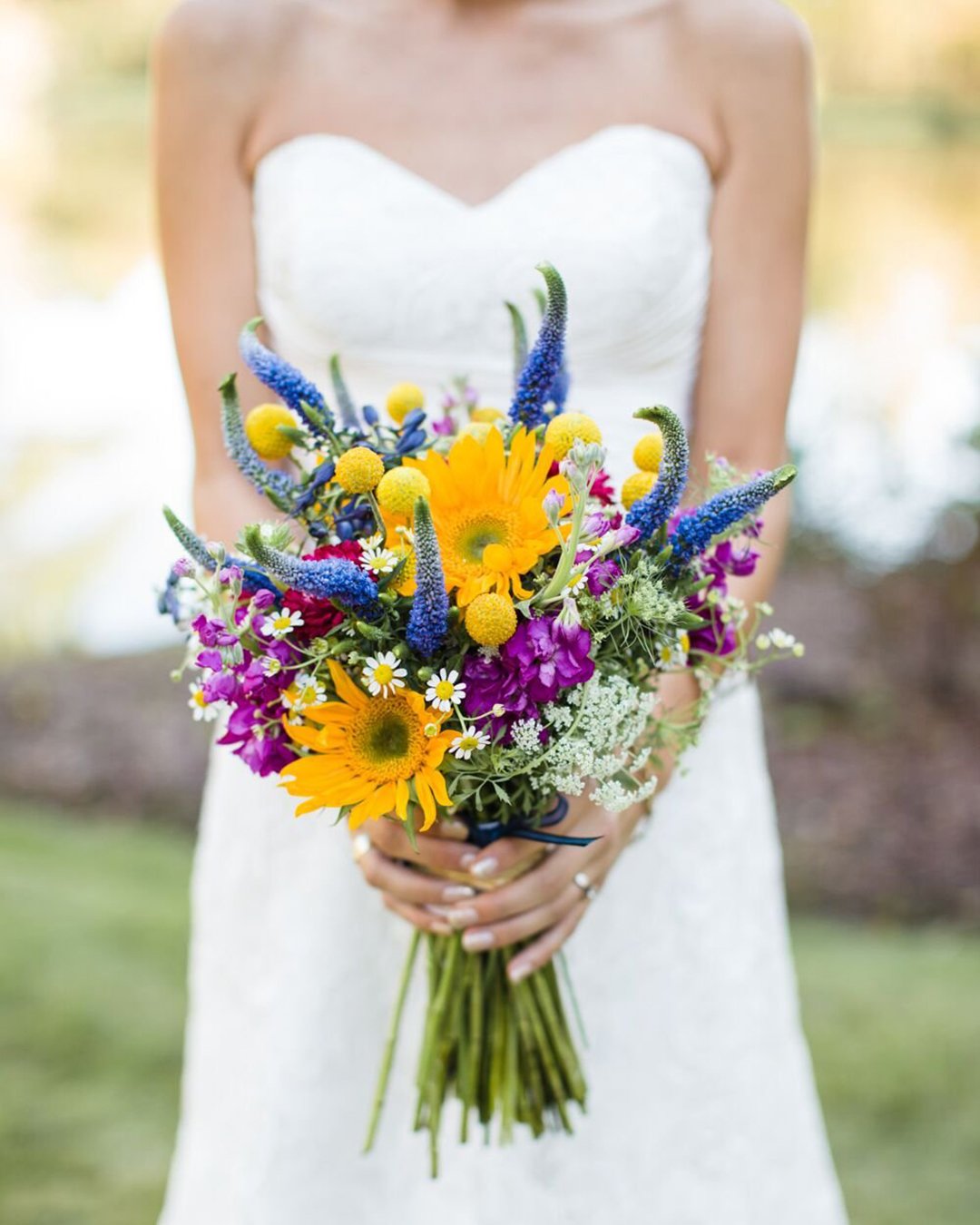 wildflower wedding bouquets bright with purple and violet flowers and camomiles jeffreys florist