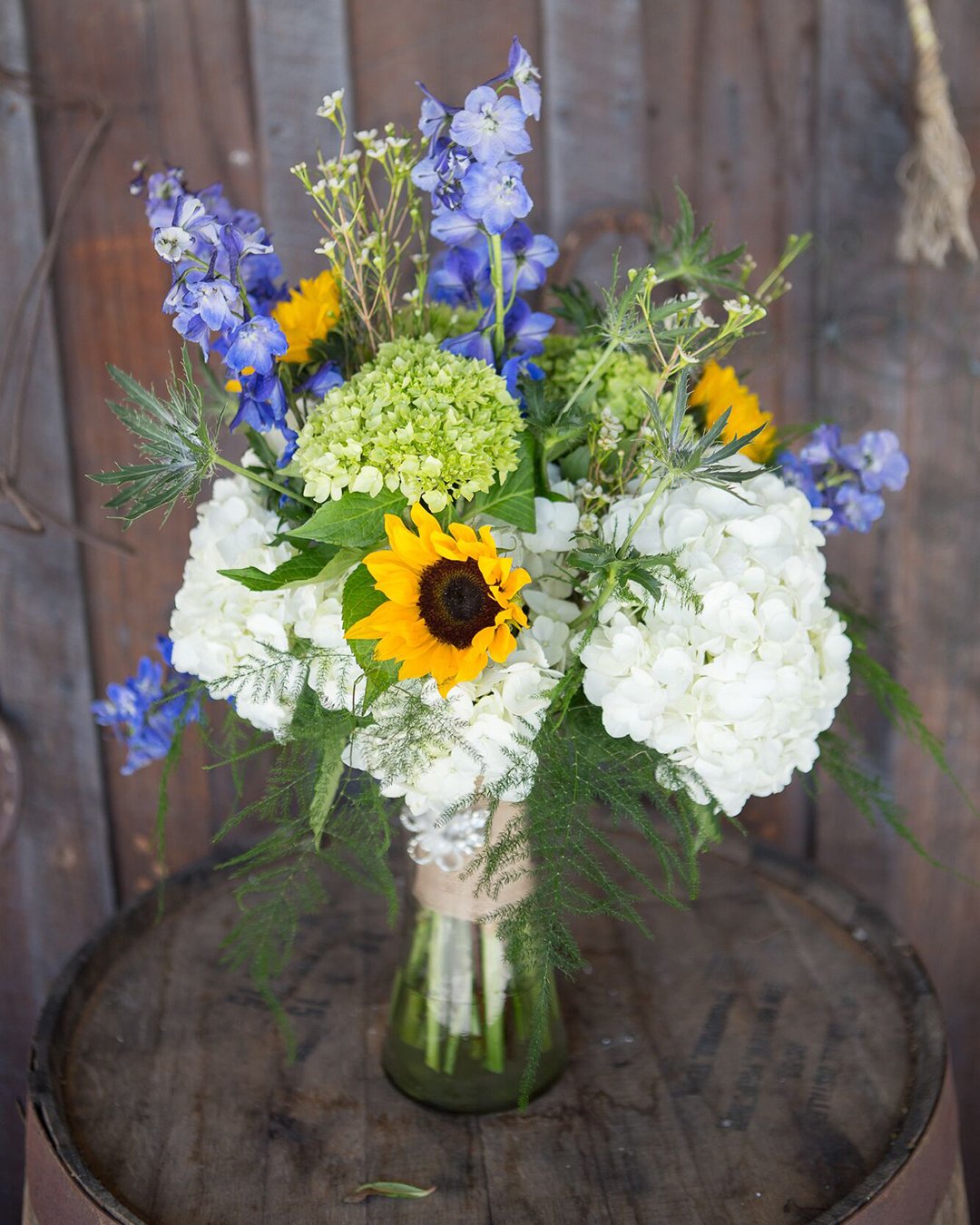 wildflower wedding bouquets small with white and blue flowers and sunflowers smith studios photography