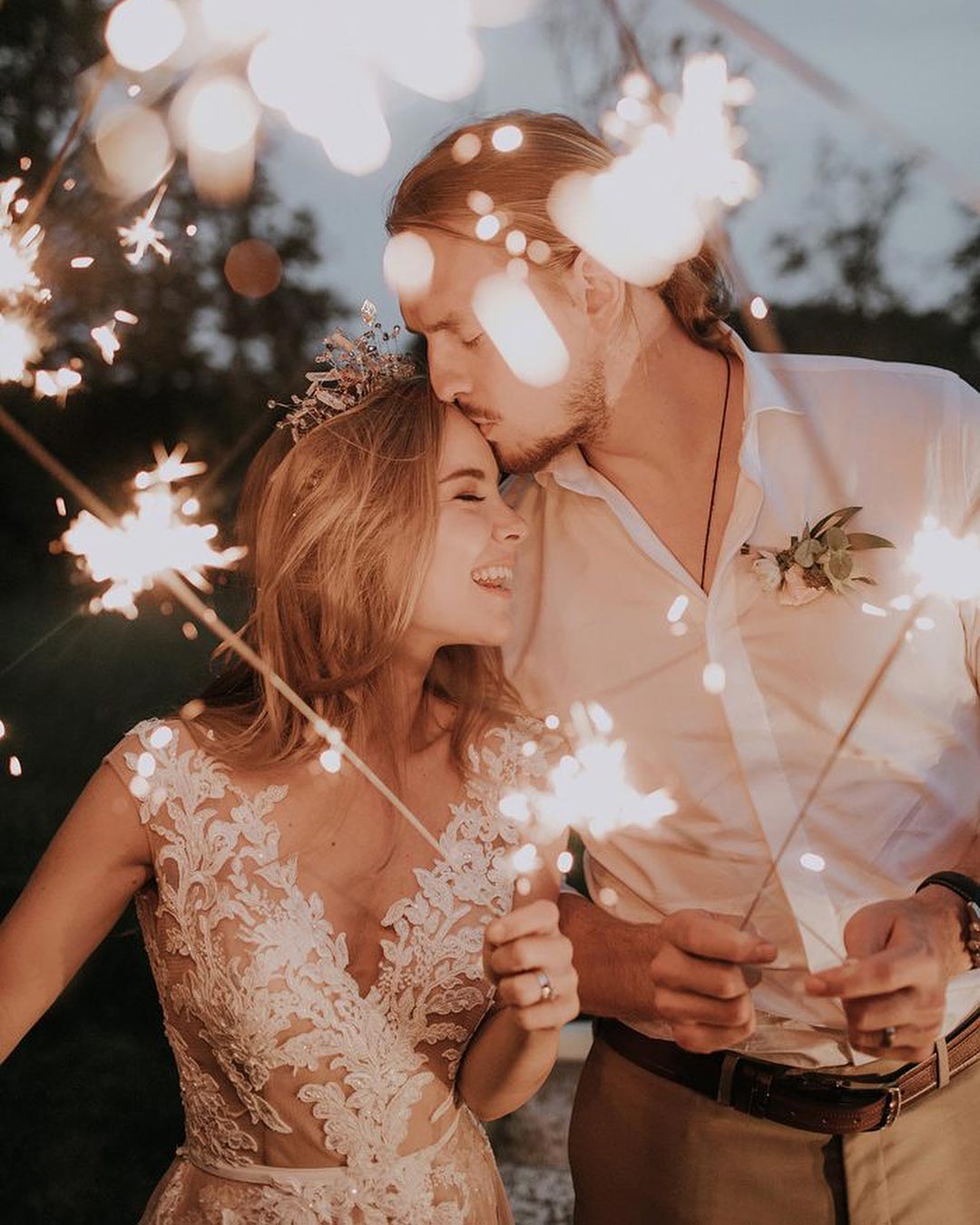 bride and groom with extra long sparklers