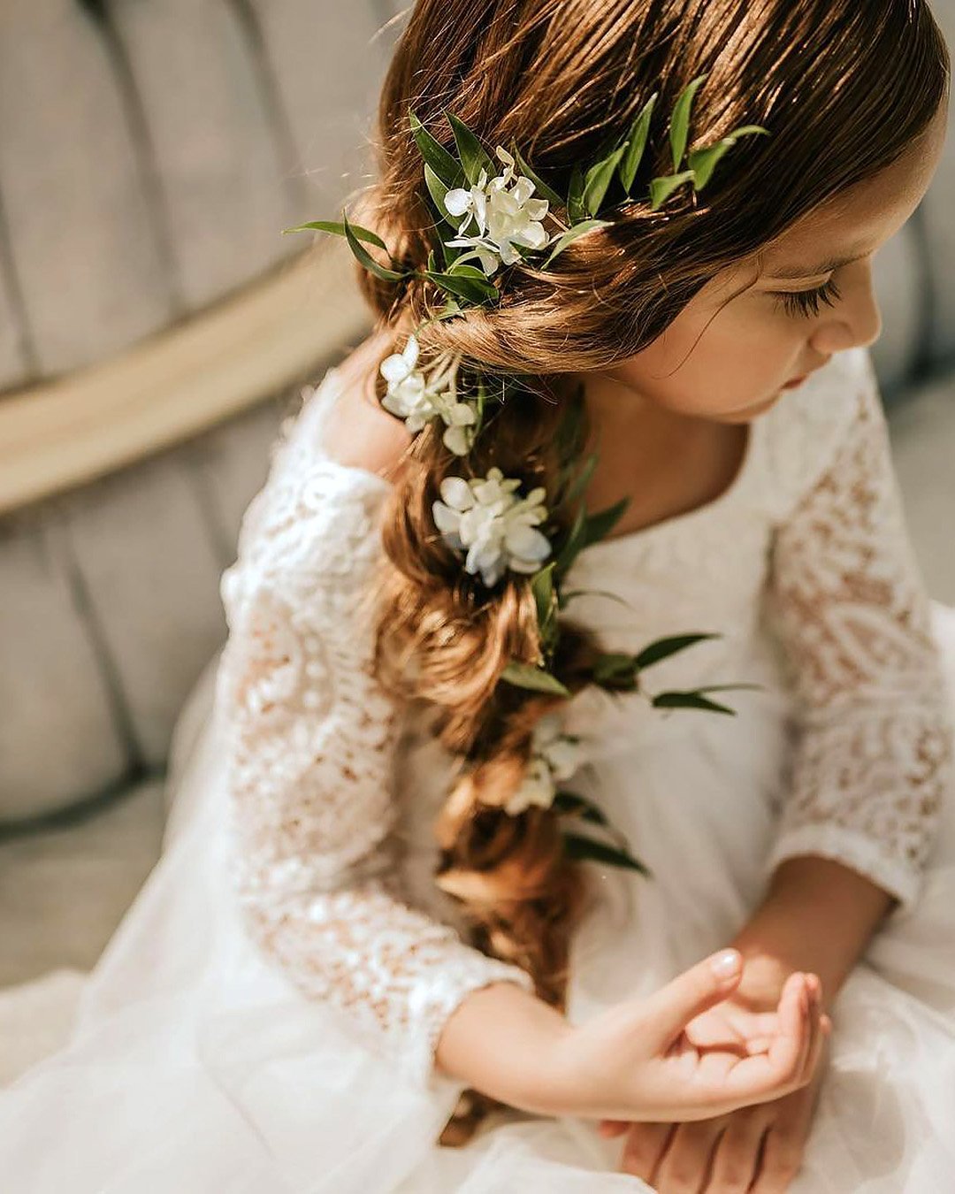 flower girl hairstyles side braid with flowers and greenery covingtonfarmweddingsandevents