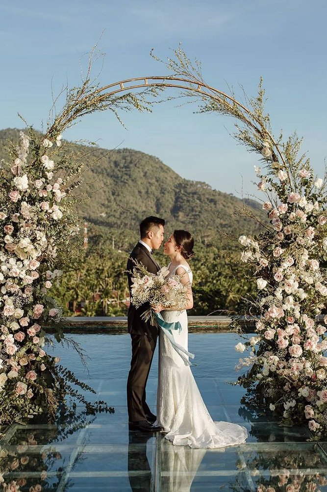 wedding couple outdoor vows exchange flower arch iamflower.co