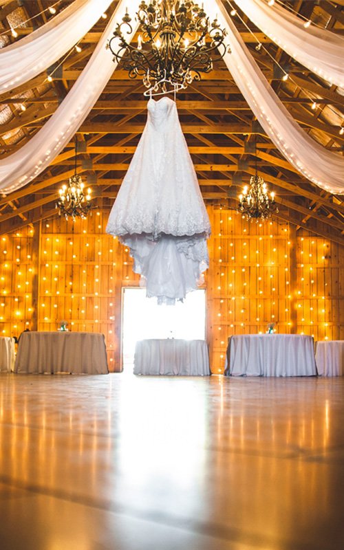 https://www.weddingforward.com/wp-content/uploads/2021/10/barn-wedding-decorations-unsplash.jpg