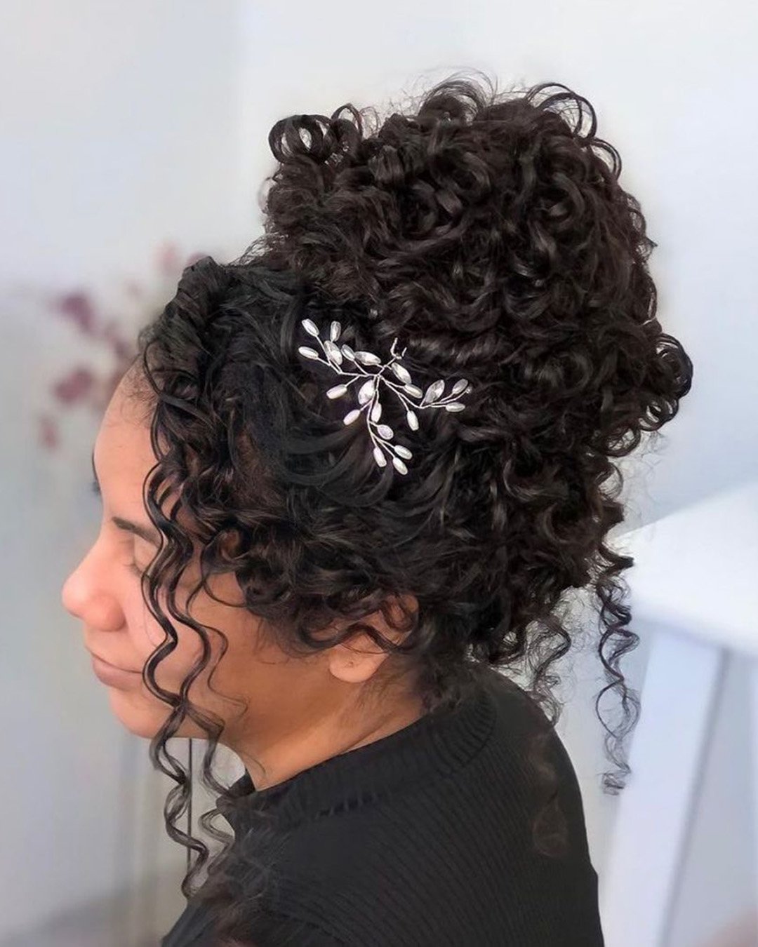 black women wedding hairstyles high bun with curls and silver pin natalymirandahair
