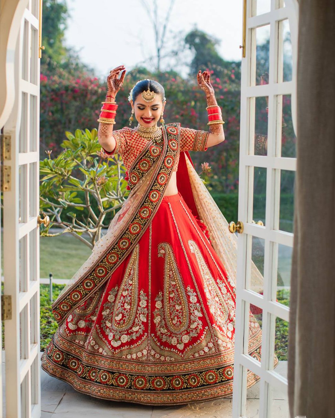 indian wedding dresses red traditional sari with gold MalvikaPeriwalPhotography