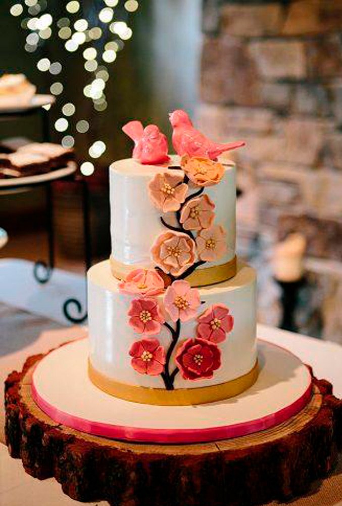 unique-wedding-cake-toppers-coral-ceramic-birds-on-the-top-of-a-wedding-cake-jacilyn-m-334x500