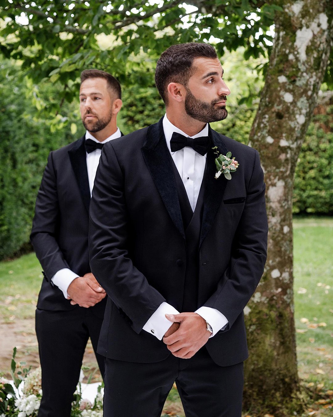 groomsmen attire black with bow tie bouttoniere chelseawhitephotog