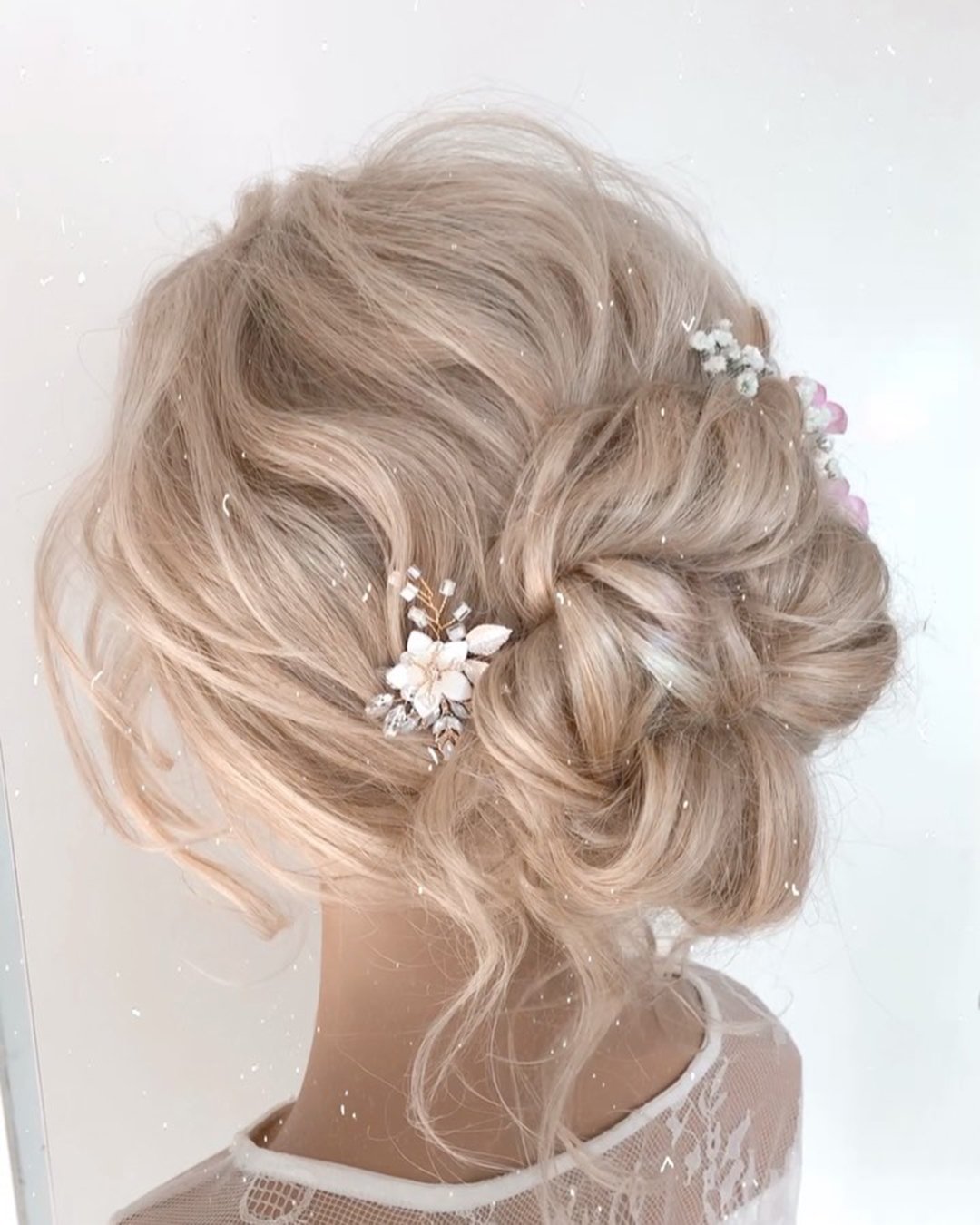 wedding updos for long hair blonde volume bun with hair pin reneemarieacademy