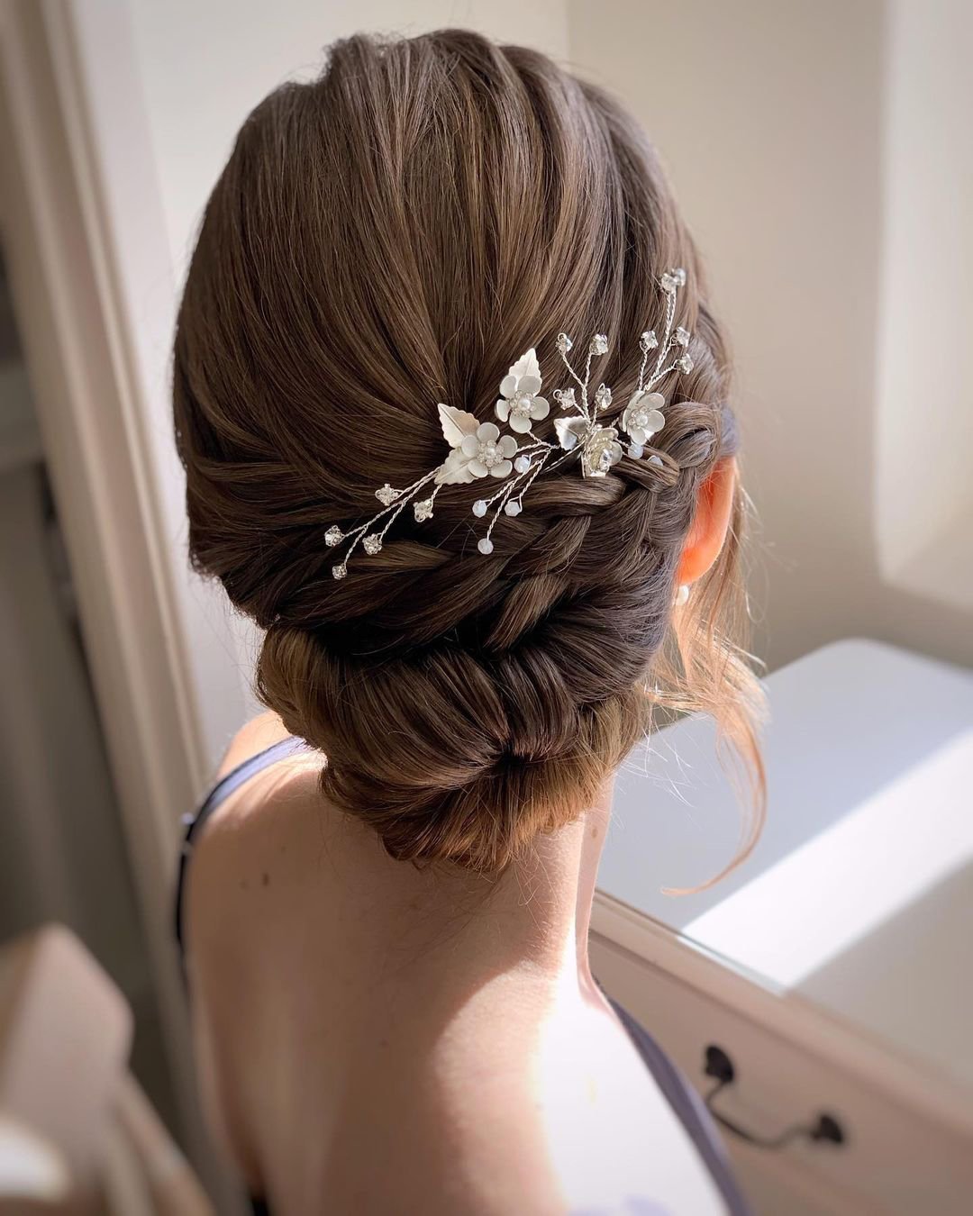 wedding updos with braids low bun with side braid and pin bridal_hairstylist