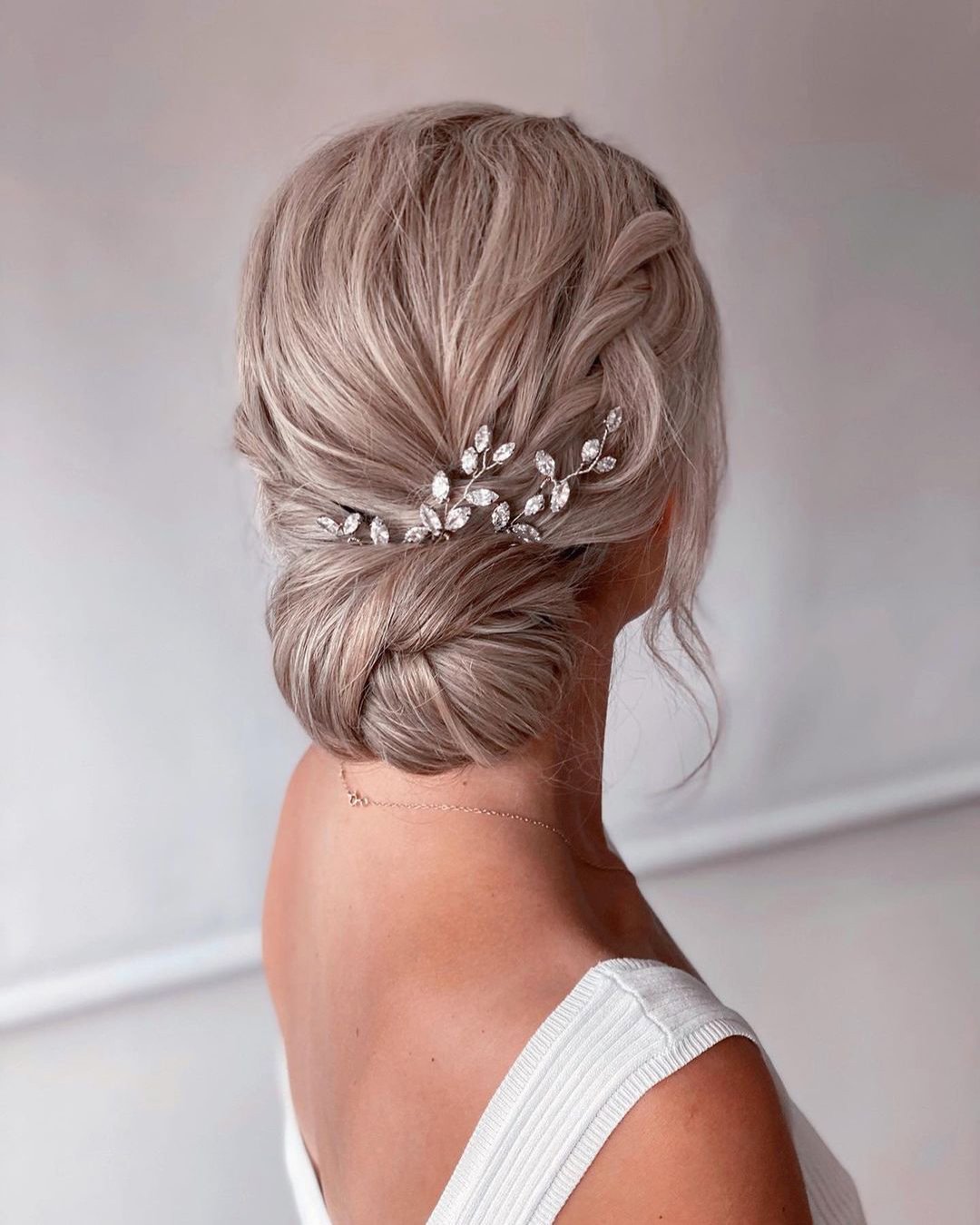 classic wedding hairstyles simple low bun with crystal pins monamieweddinghair