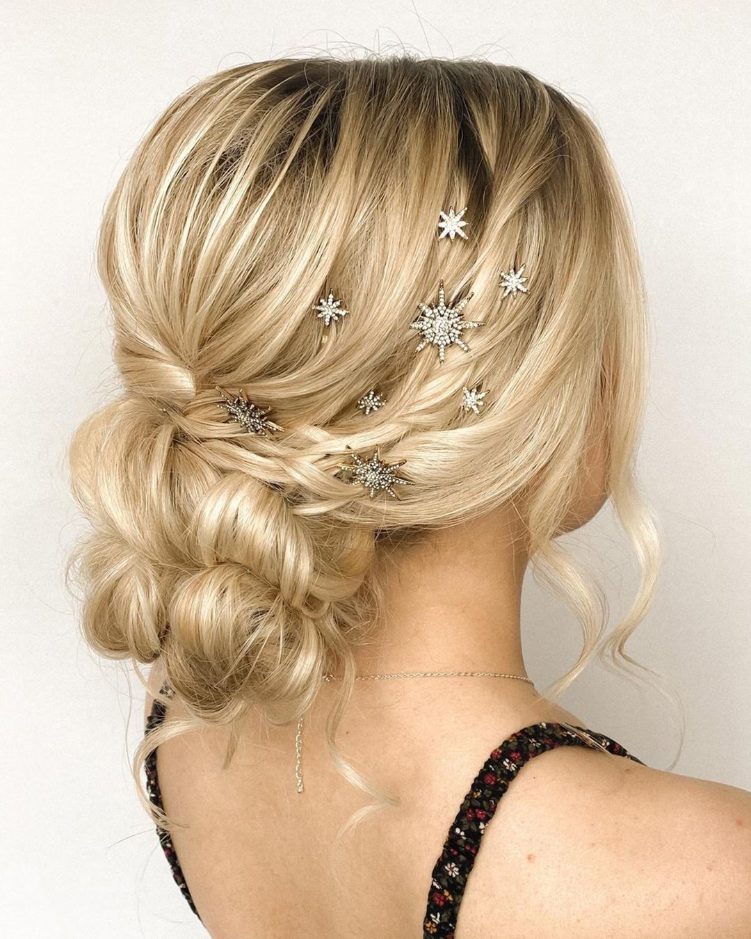 elegant wedding hairstyles textured low bun with crystal pins lauralovesshair