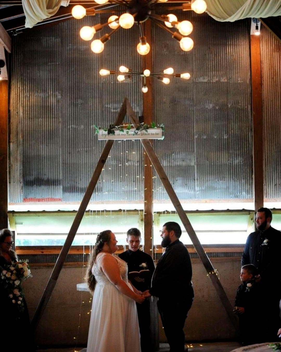 rustic wedding venue in michigan barn indoor aisle