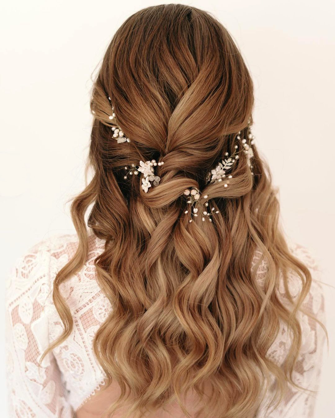 classic wedding hairstyles wavy hair down with white flower pins unityrhodesbridal