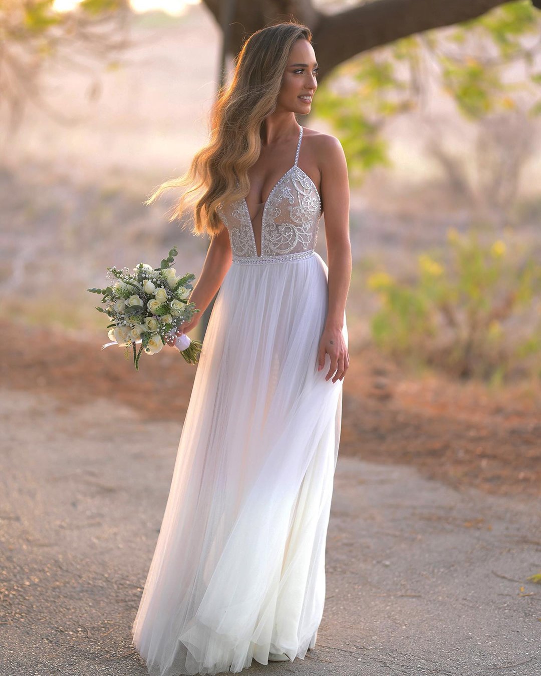 bare revealing bride dress