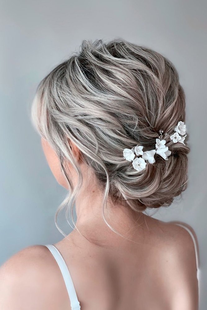 easy wedding hairstyles textured low updo with flower pins monamieweddinghair