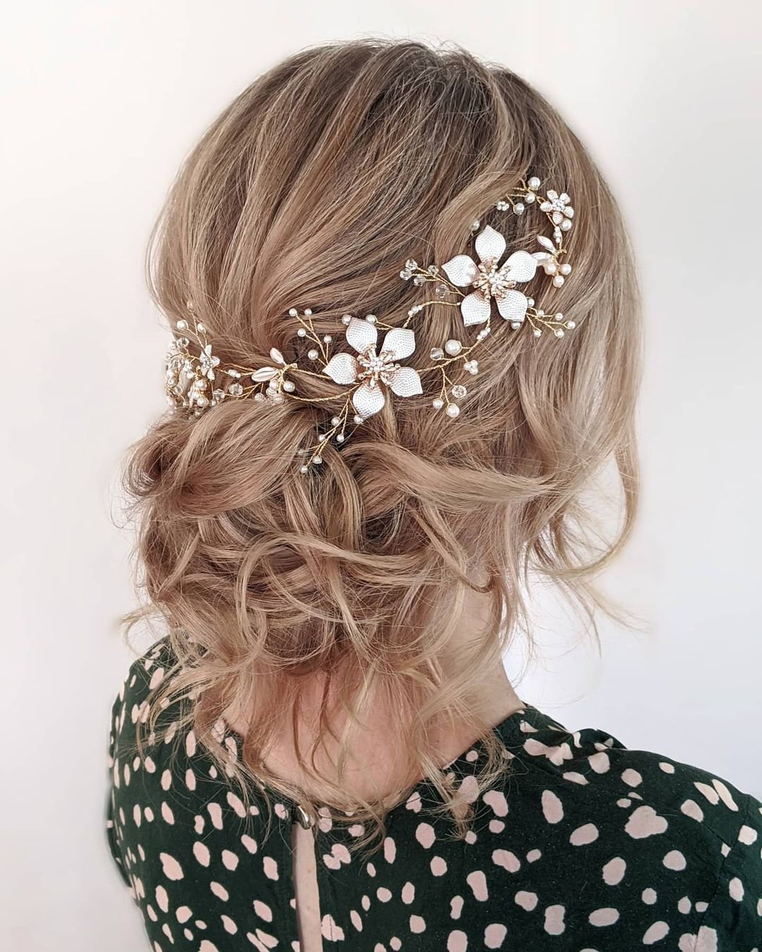 mother of the bride hairstyles updo with flower vine hannahblinkohairstylist