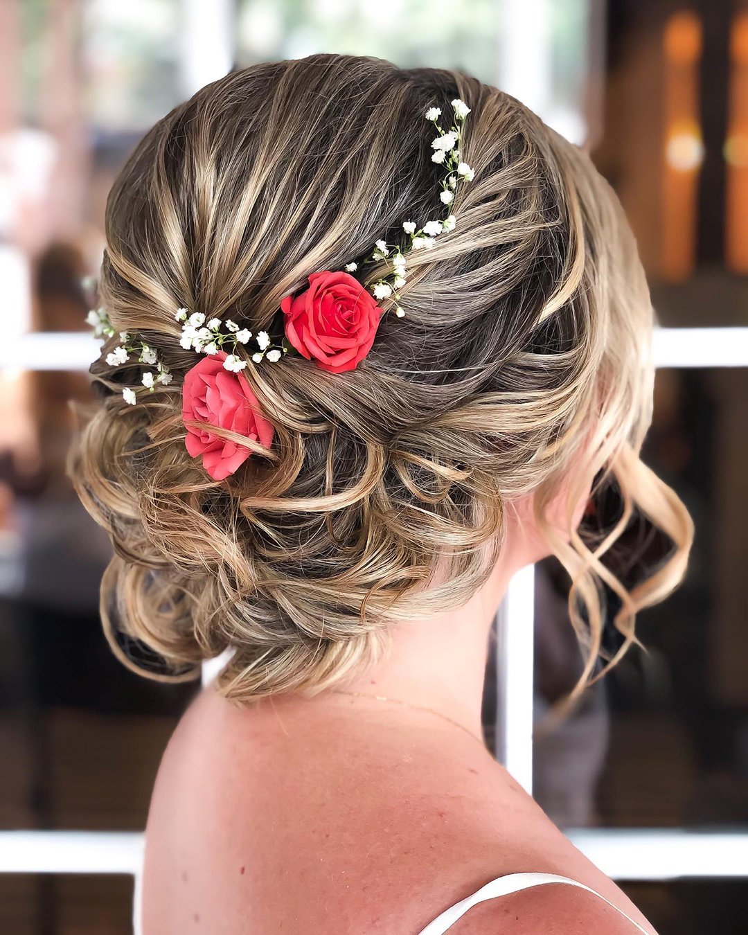 rustic wedding hairstyles messy updo with roses and baby breath reneemarieacademy