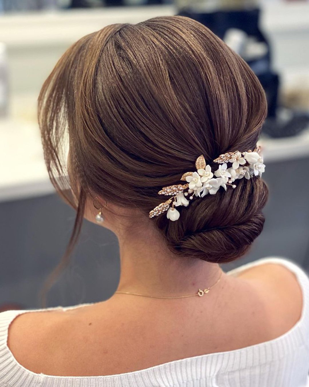 wedding bun hairstyles elegant and classy with white gold headpiece alicekapitein_hairstyling