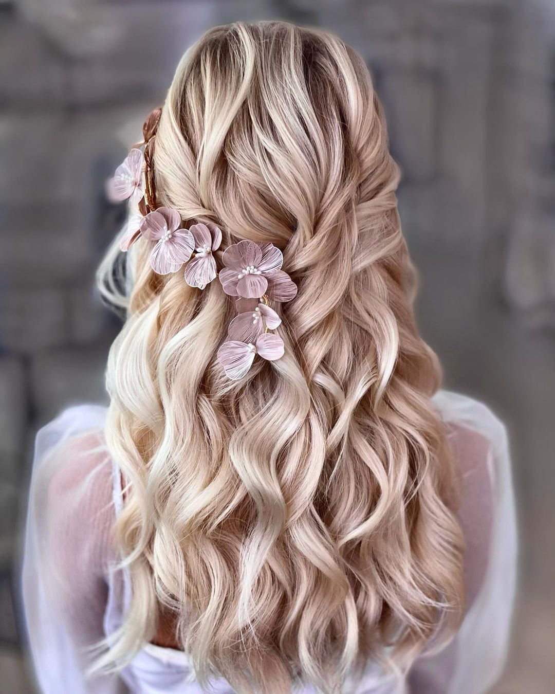 wedding hairstyles for curly hair half up with pink flowers kasia_fortuna