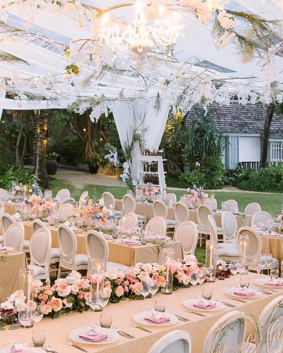 wedding tent decorated with natural greenery