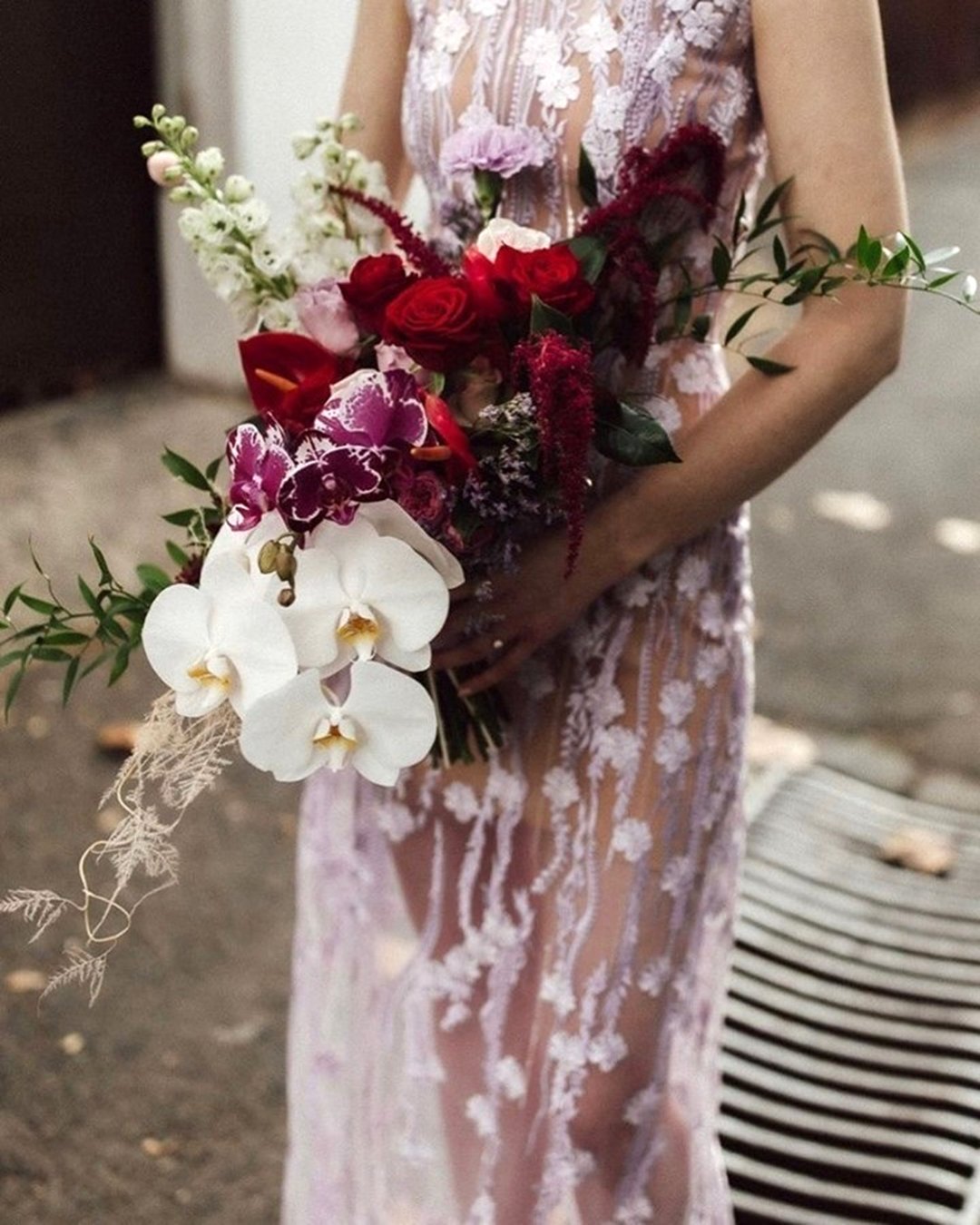 cascading wedding bouquets with orchids and whild flowers