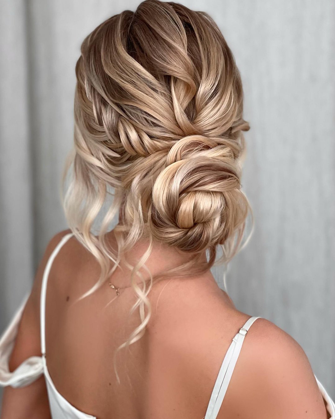 classic wedding hairstyles slightly messy braided curly low bun kasia_fortuna