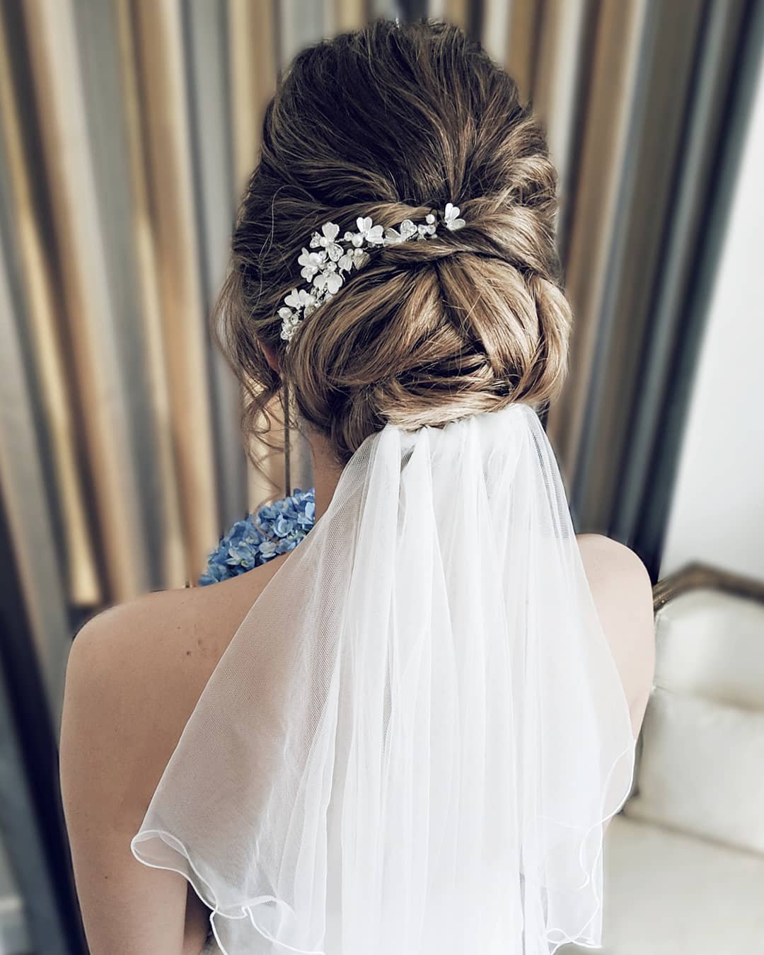 elegant wedding hairstyles low bun with veil hannahblinkohairstylist