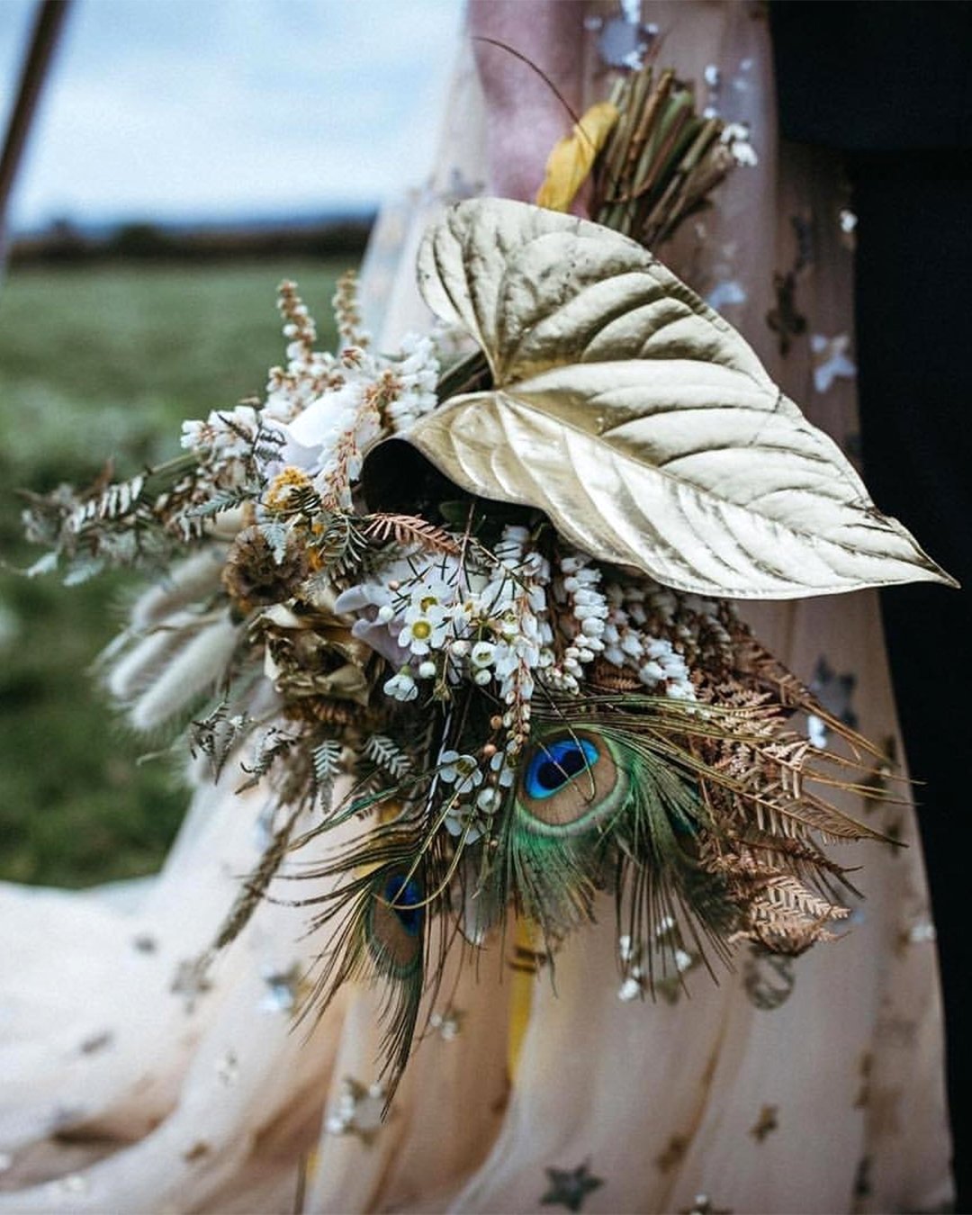 fall wedding bouquets with feathers