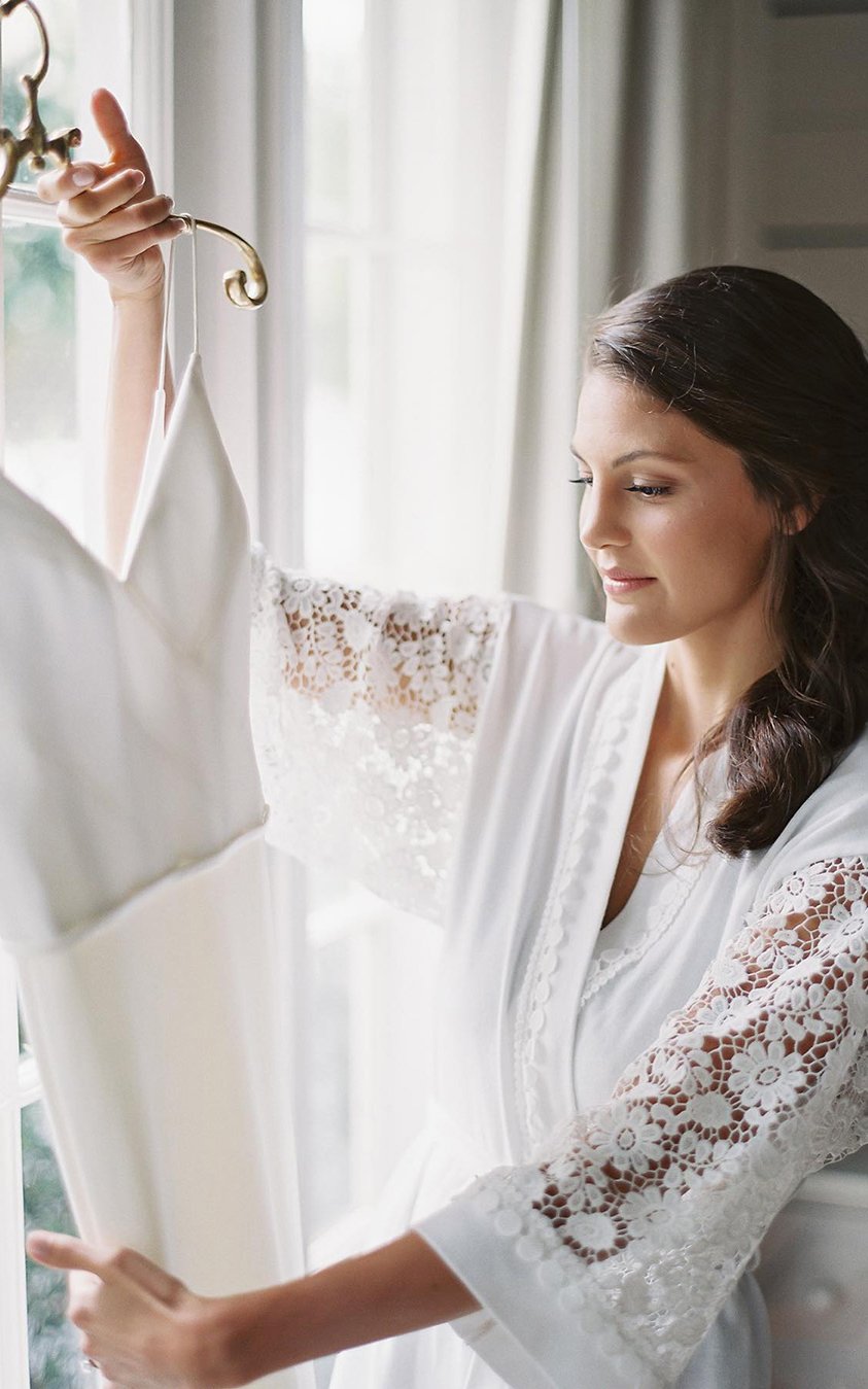 must take photos wedding dress bride near window with dress vickigrafton